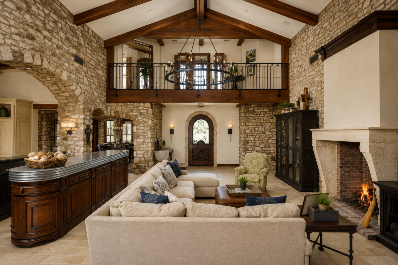 DC Ranch Villa, great room with stone walls, wood beams, and loft