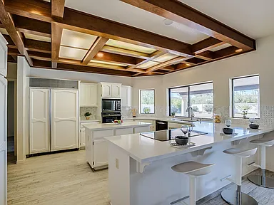 Sutton renovation, before photo of the kitchen with coffered wood ceiling