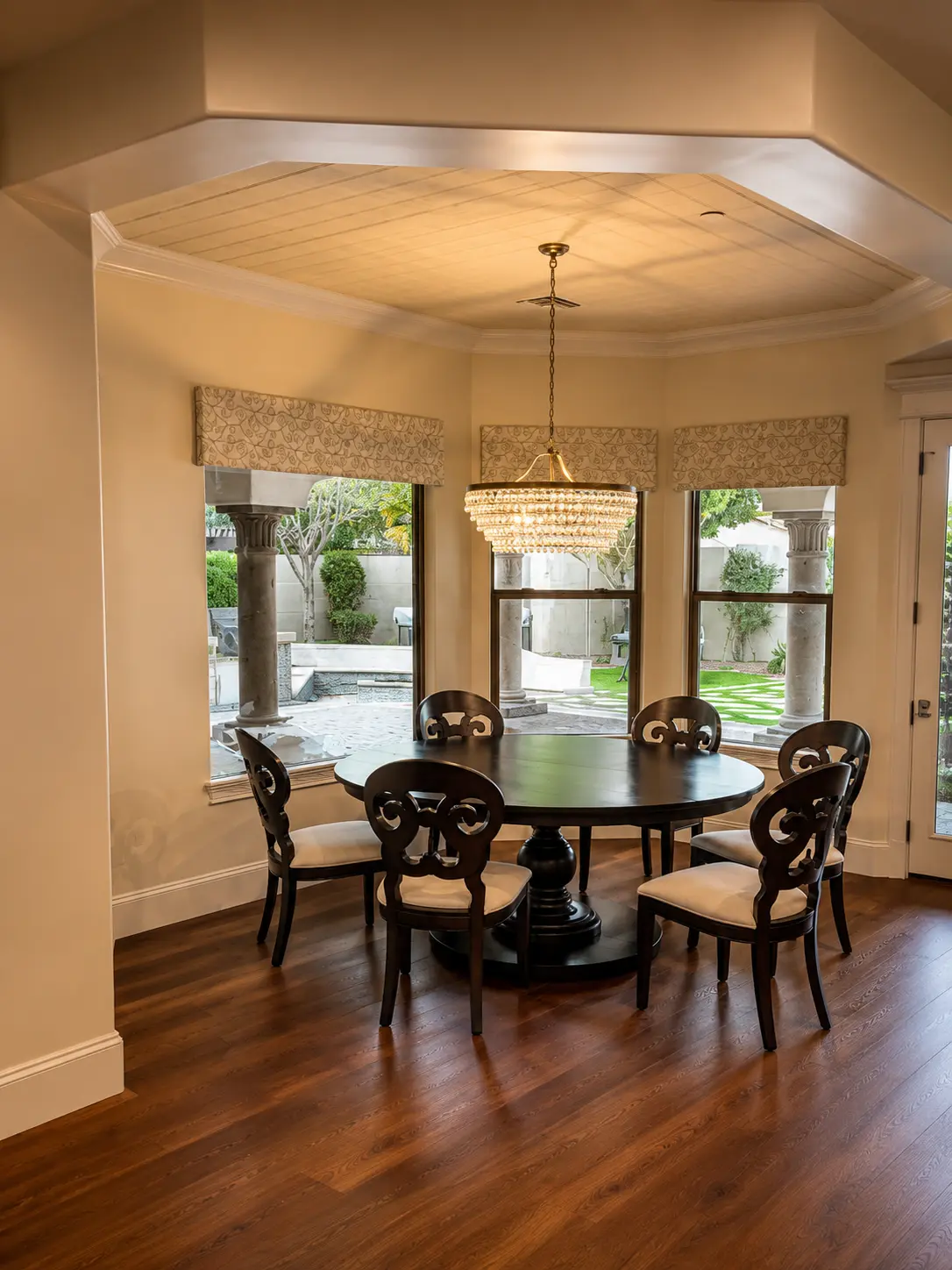 Dartmouth renovation, breakfast nook with crystal chandelier and courtyard views