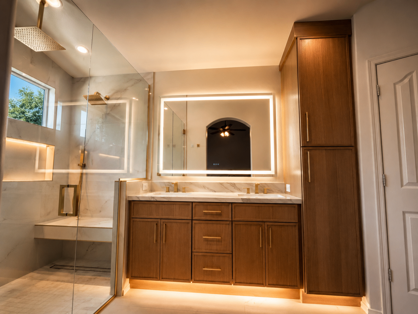 Rockwood primary bath with backlit mirror, marble shower, and walnut vanity