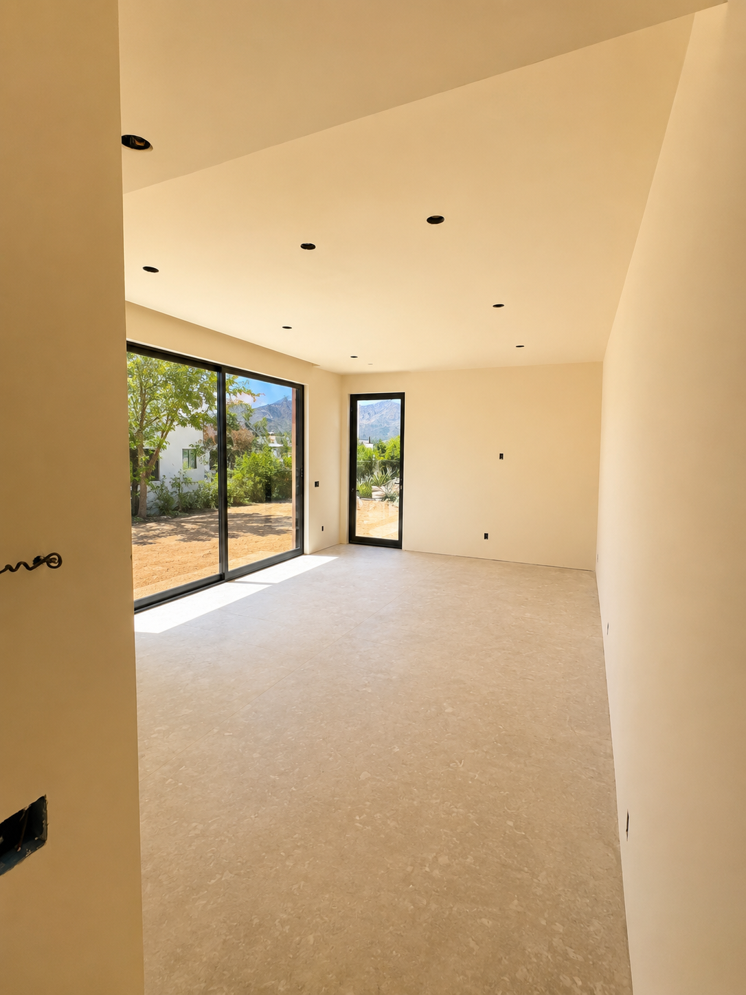 Camello, interior room with sliding glass door opening to mountain views