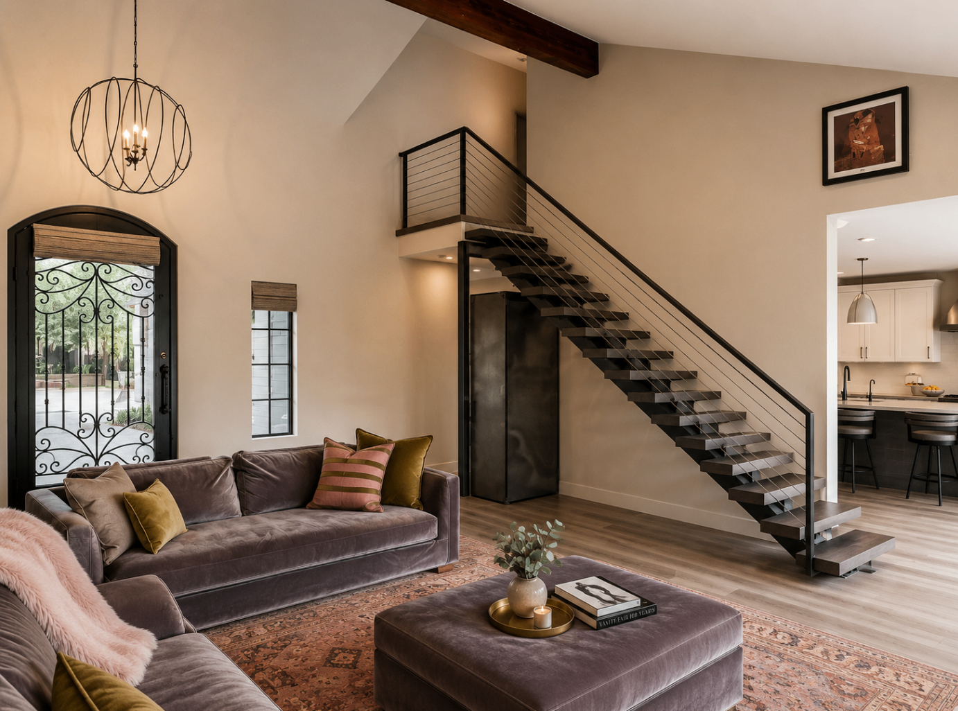 Caron Street, great room with floating staircase and iron entry door