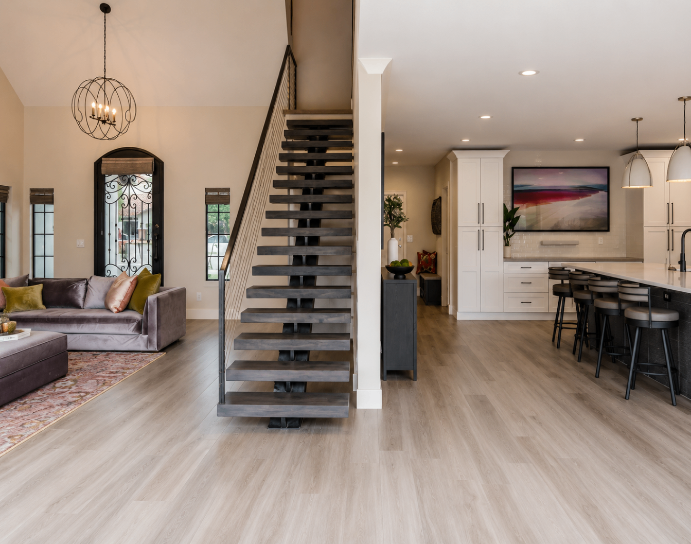 Caron Street, open stair hall connecting the living room and kitchen