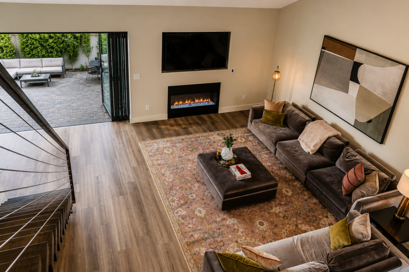 Caron Street, upper view over the living room toward the fireplace and patio
