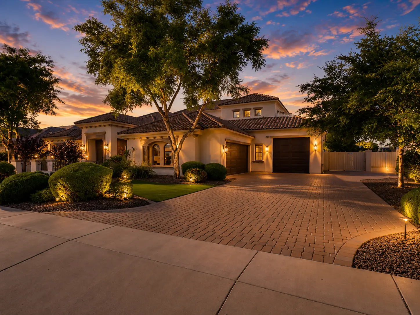 Dartmouth renovation, paver driveway and garage elevation at dusk