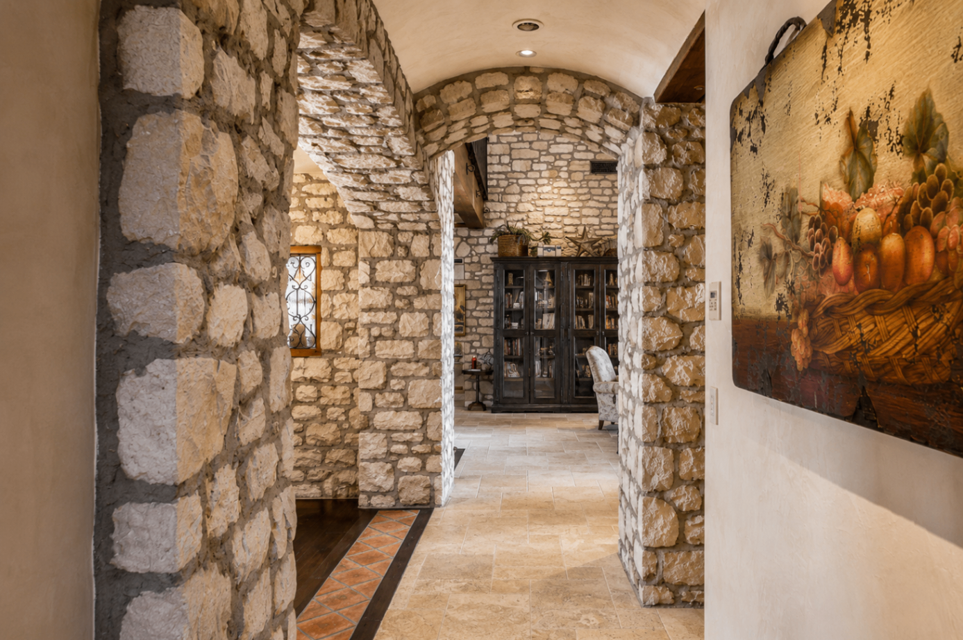 DC Ranch Villa, stone archway hallway with vaulted ceiling