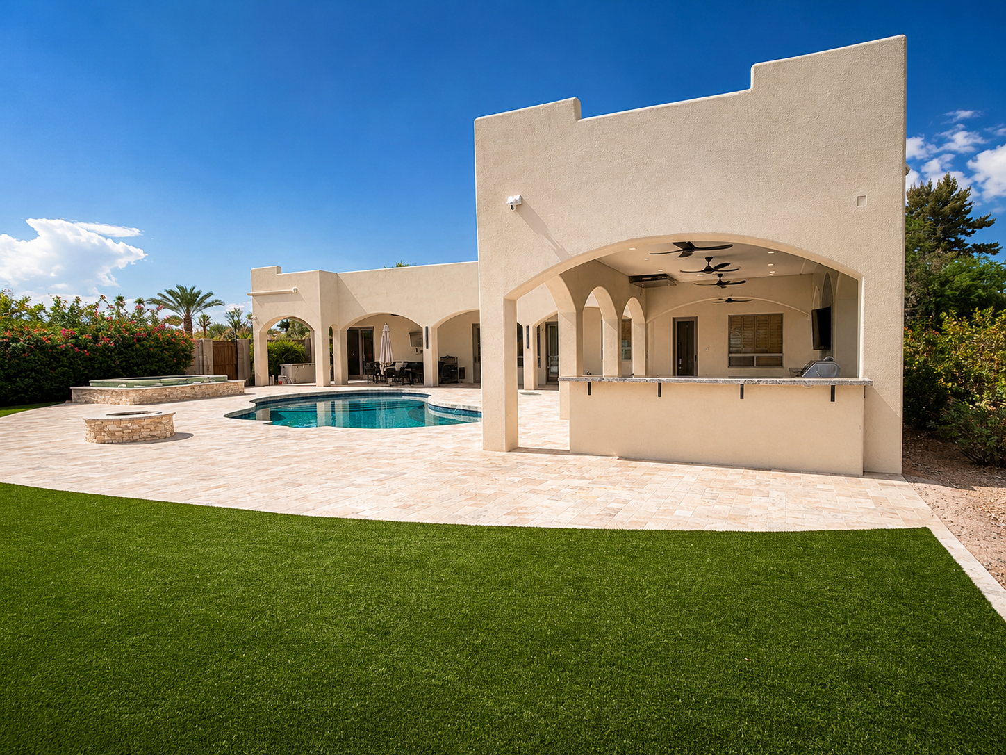Wood Street backyard with arched patio, pool, spa, and turf lawn