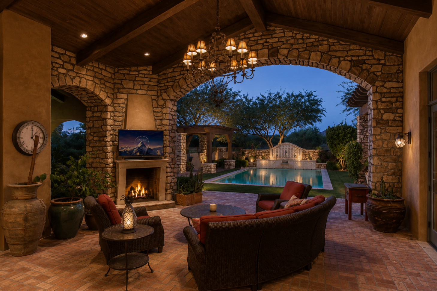 DC Ranch Villa, covered patio lounge with stone fireplace overlooking pool