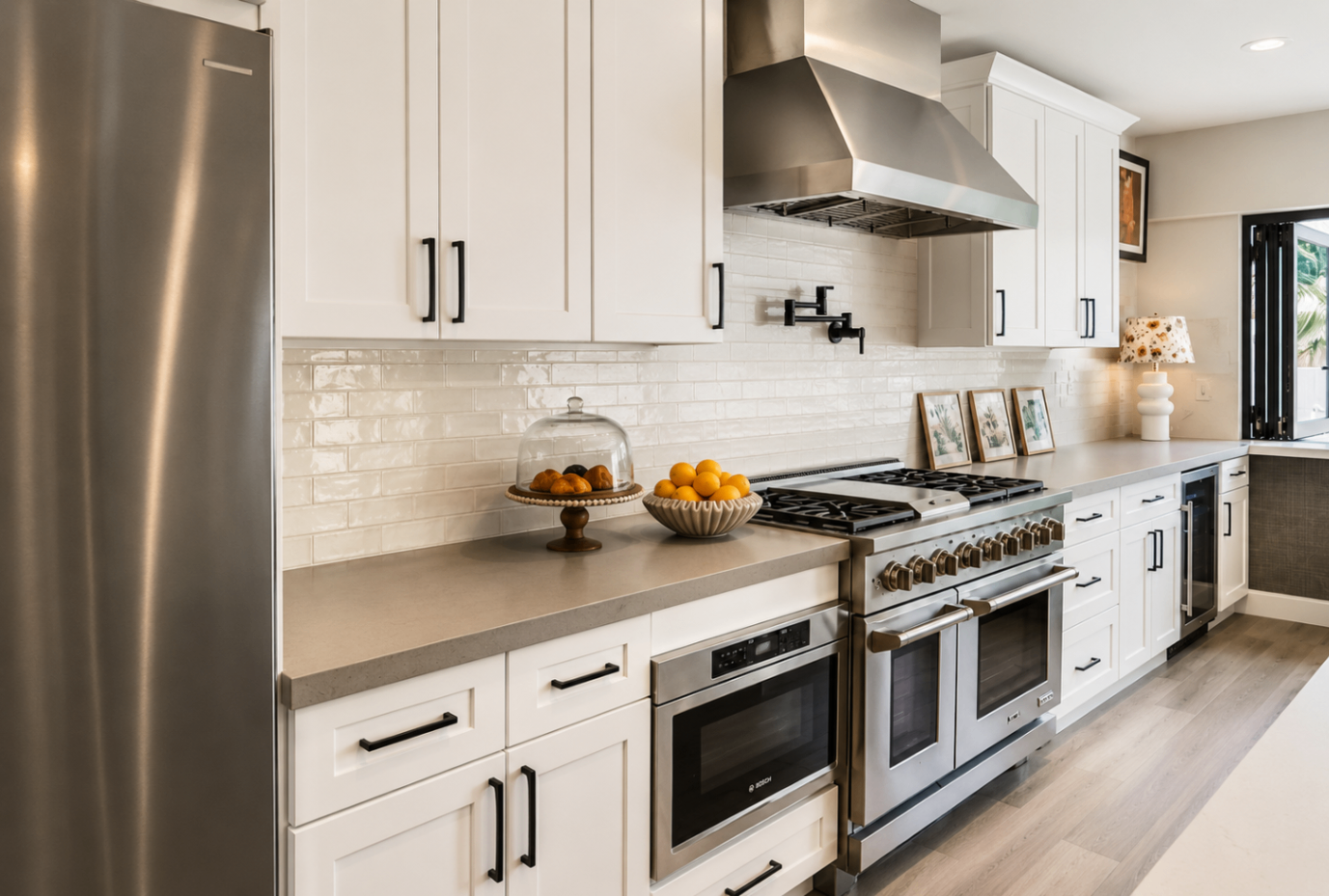 Caron Street, kitchen range wall with white cabinetry and black hardware