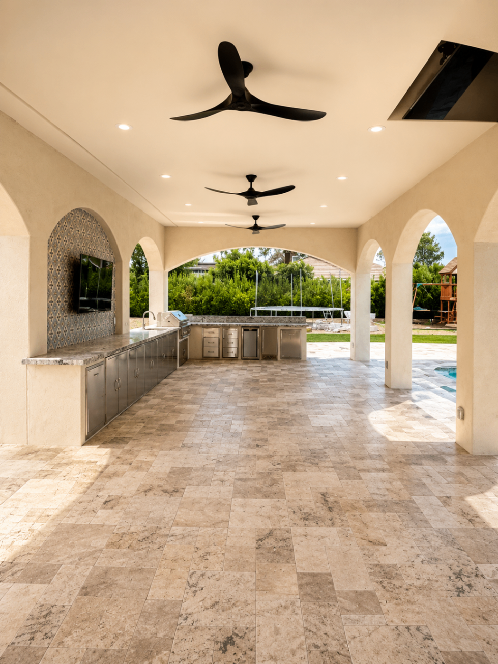 Wood Street covered patio with travertine floors, arches, and outdoor kitchen