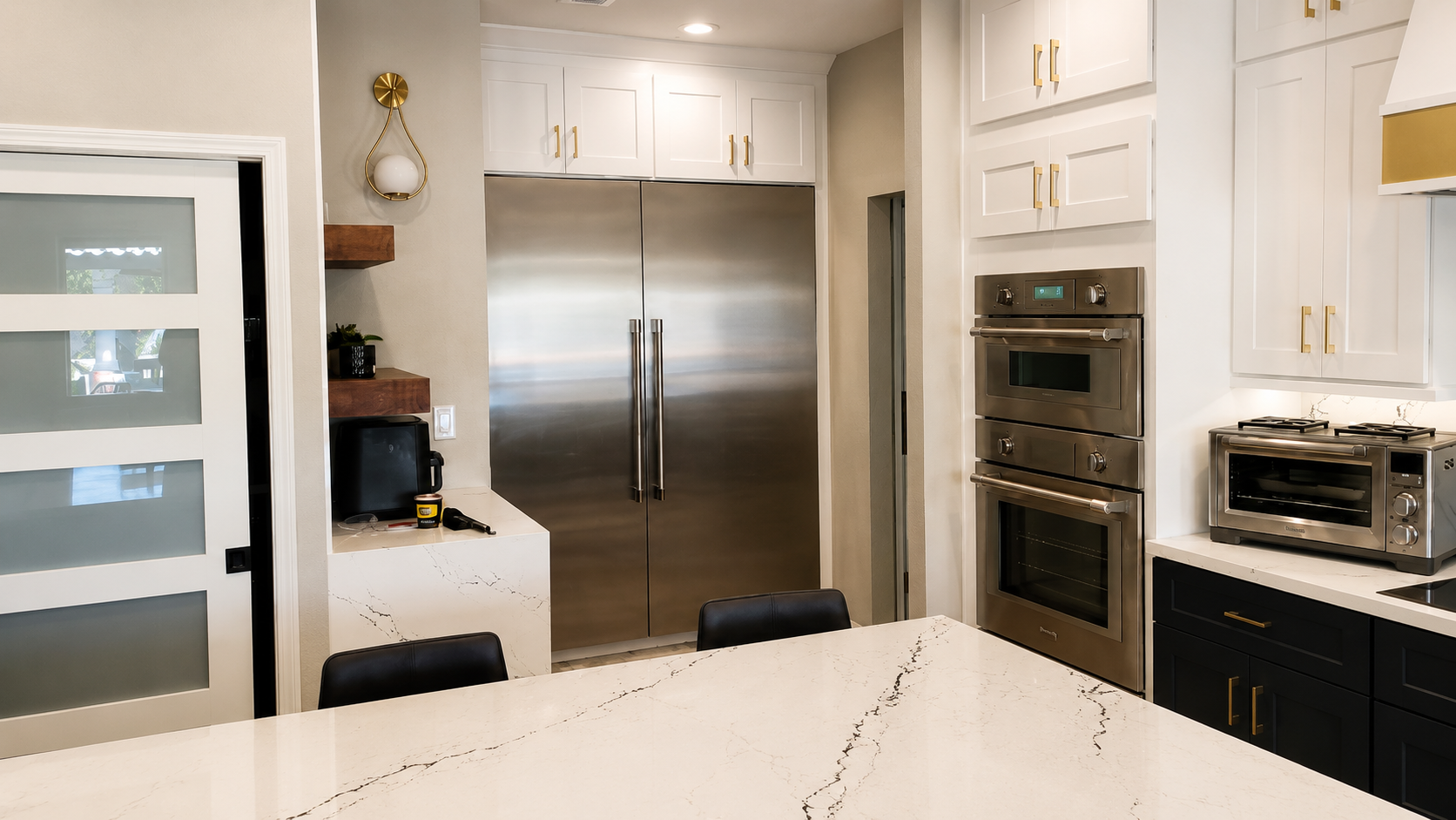 Sutton renovation, after view of the built-in refrigerator wall and double ovens