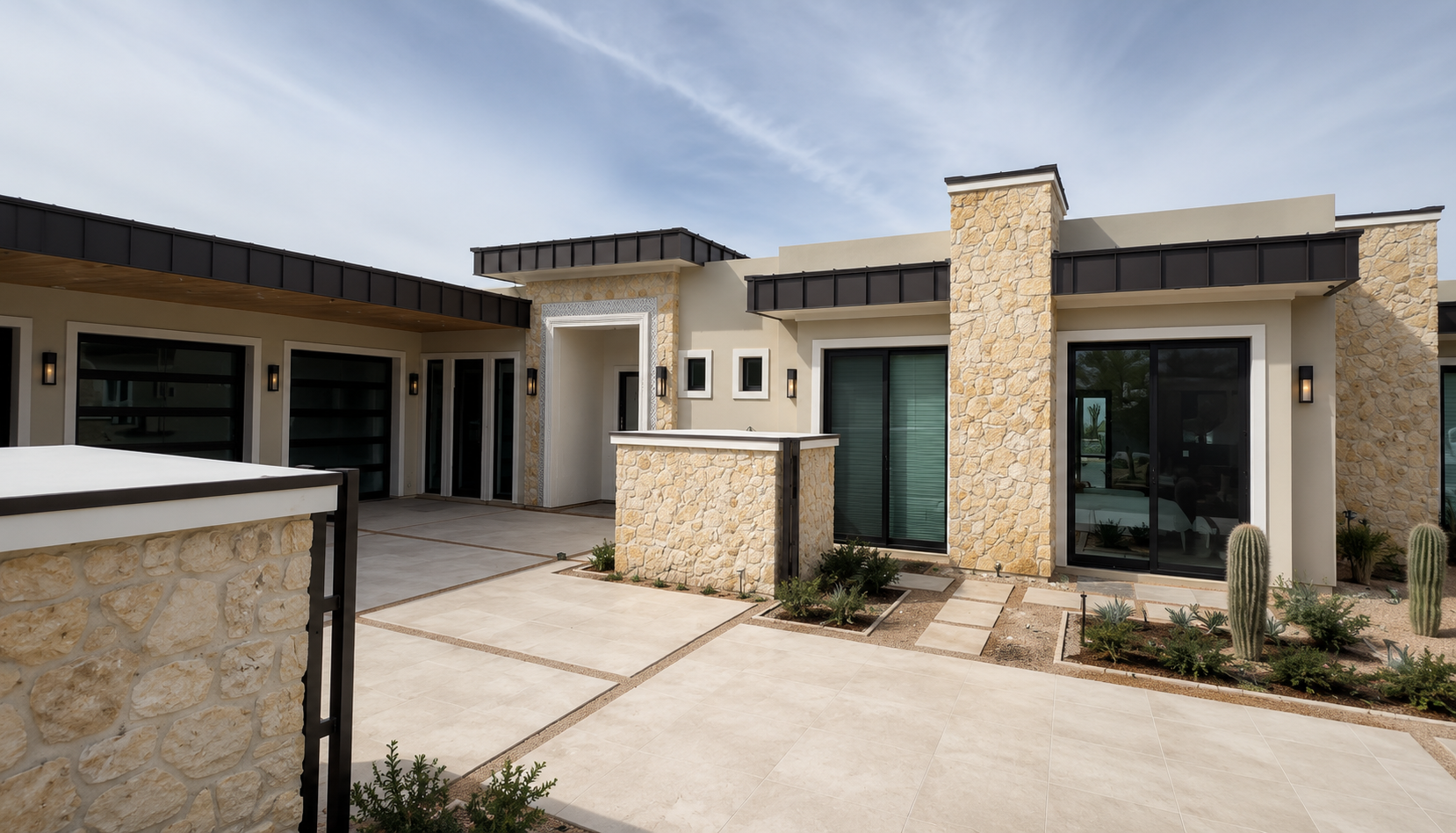 La Senda, entry courtyard with layered stone walls and modern rooflines